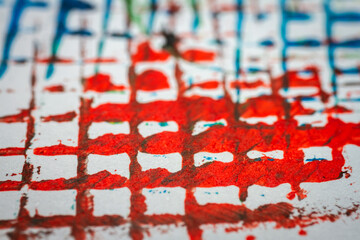 Extreme close up of colorful acrylic paint texture showing brush strokes. Selective focus.