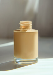 foundation in a glass package in a home interior during use