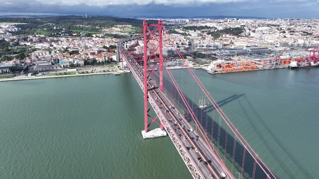25 Of April Bridge At Lisbon In Lisbon District Portugal. Downtown City Skyline. Transportation Scenery. 25 Of April Bridge At Lisbon In Lisbon District Portugal. Famous Cable Stayed Bridge.