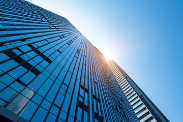 The glass exterior wall of the skyscraper in the financial center
