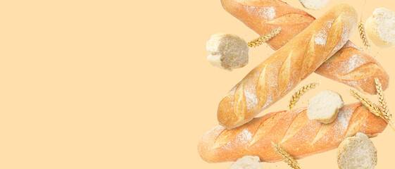 Fresh bread and spikes falling on beige background. Banner design with space for text