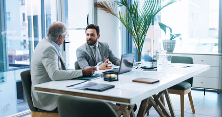Business men, laptop and team discussion in office, planning or brainstorming insurance strategy with paper. Computer, meeting and conversation with boss for report, risk management and explain idea
