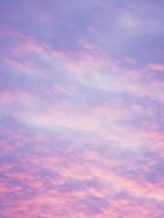 Obraz premium Beautiful pastel sky at sunset, showcasing soft pink and purple hues blending seamlessly, creating a serene and dreamy atmosphere for nature lovers.