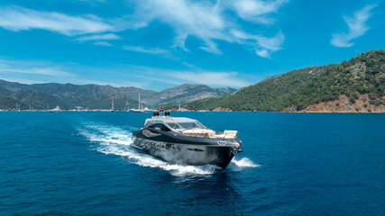 Luxury Yacht at Full Speed on the Open Ocean – Aerial Perspective


