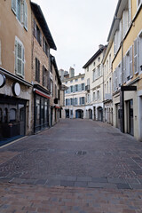 Bourg en Bresse with typical shopping street with shops and cafes in France