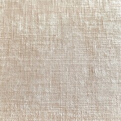 Fototapeta premium close-up of beige woven fabric texture showing detailed interlaced threads and fine textile pattern