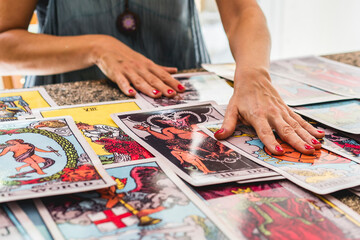 Tarot reader mixing the giant Tarot cards