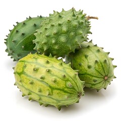 A stack of spiky horned melon fruits isolated on a white background