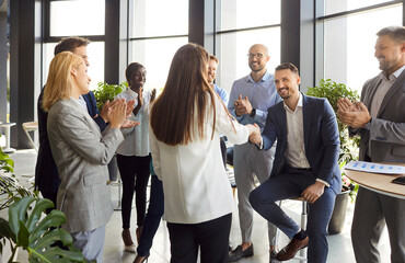 Business people introduce new female employee worker on group meeting in modern office, welcome...