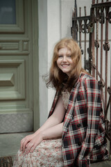 young beautiful woman in vintage suit in european city