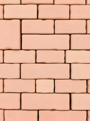 Obraz premium Close-up shot of a series of interlocking paving bricks, arranged in a partial pattern, isolated on a white background to demonstrate their design and potential layout.