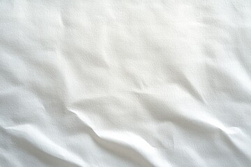 Close-up of a white textured wrinkled fabric surface creating soft shadows and subtle folds