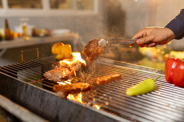 Juicy, tender steak sizzles over open flames on a rustic barbecue grill, with herbs and smoke enhancing the rich aroma of outdoor cooking.
