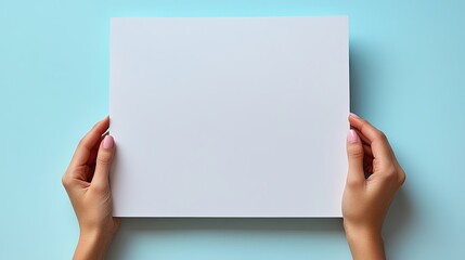 Blank white paper held by hands