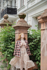 young beautiful woman in vintage suit in european city