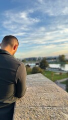 Man is photoshooting the landcape before the sunset in travel 
Is wearing shirt and the weather is perfect