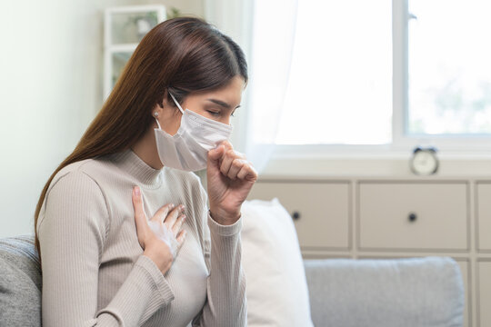 Female unhealthy Sickness, asian young woman, girl unwell and coughing, have cold, sore throat isolated white background suffering with symptom cough feeling bad. Healthcare of Coronavirus, covid-19.