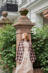 young beautiful woman in vintage suit in european city