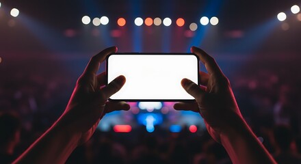 Capturing memories at a vibrant concert, smartphone displaying a blank screen