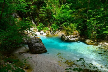 Fototapeta premium Beautiful Kamniška Bistrica turquoise colored river in Gorenjska, Slovenia