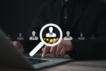 Businessman selecting candidate profile with five-star rating icon on laptop screen, representing employee evaluation, talent recruitment, HR management, job performance review, and digital hiring pro