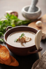 Homemade mushroom soup in bowl on the table.