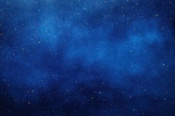 Obraz premium Vast night sky filled with countless glowing stars against a deep blue cosmic background inspiring wonder and serenity