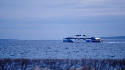Boat sailing at sea after dawn