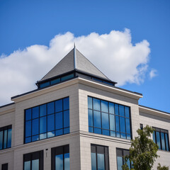 Modern Geometric Design Commercial Building with Reflective Glass in Urban Landscape