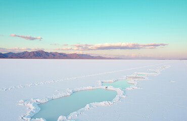 Fototapeta premium Pastel turquoise sunrise salt flat.