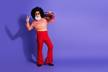 Charismatic elderly man in retro disco attire posing against a vibrant purple background with a...