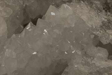 White crystal cluster inside a natural geode formation. Ideal for geology, mineralogy, earth science, or decorative mineral-themed educational and commercial stock use