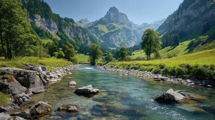 Fototapeta premium Picturesque alpine river winding through lush valley