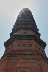 Historic pagoda reaches toward the blue sky in northern Vietnam, showcasing stunning architecture and ancient craftsmanship