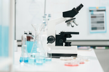 Microscope-focused research in modern laboratory environment, highlighting advancements in medicine technology, experimentation through the precision and dedication of scientist