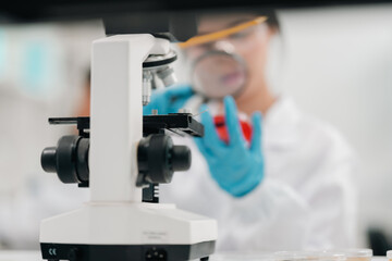 Microscope-focused research in modern laboratory environment, highlighting advancements in medicine technology, experimentation through the precision and dedication of scientist