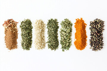 Colorful Spices Arranged in Vertical Strips on White Background