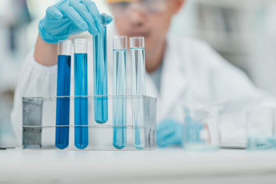 Medical research team conducting scientific experiments in a pharmaceutical laboratory, analyzing samples under microscopes to develop innovative medicine and healthcare solutions