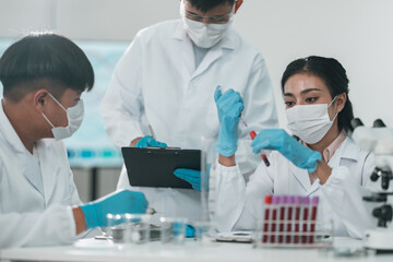 Medical research team conducting health and pharmaceutical experiments using blood samples in laboratory to develop advanced treatments and vaccines for global healthcare innovation