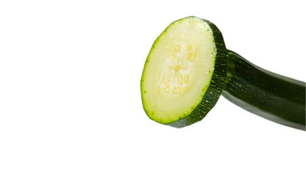 Close up of a sliced zucchini with water droplets on a transparent background in a studio shot style
