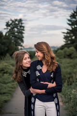 Fototapeta premium Daughter and mother hugging each other