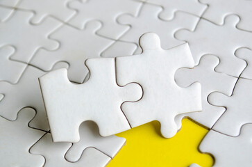 Jigsaw puzzle pieces removed from other jigsaw. Customizable space on jigsaw for text or ideas