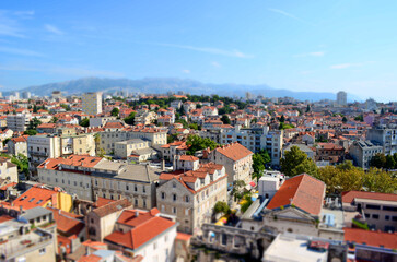 Obraz premium Tilt-shift panoramic view of Split old town with red rooftops and Adriatic architecture from church tower