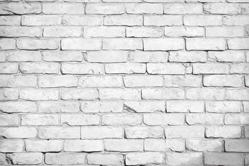Close-up view of a white painted brick wall showing texture and rough surface with natural lighting