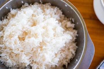 Cooked white rice or steamed rice in bowl at Thai restaurant