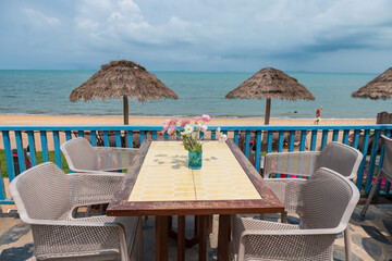 Outdoor table at restaurant patio by Pattaya Jomtien beach, Chonburi