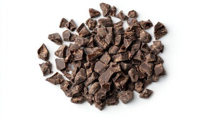 Obraz premium Close-up overhead shot of a pile of dark chocolate chunks isolated on a white background.