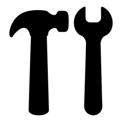 Black silhouette of a hammer and wrench on a white background