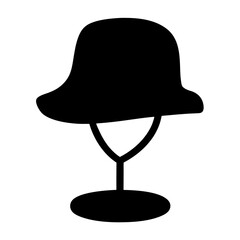 Elegant black hat displayed on a classic stand with rounded base