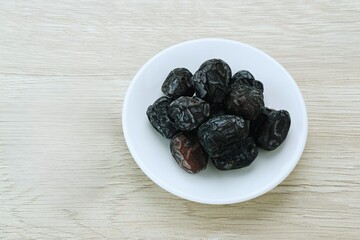 zaAjwa Dates fruits or dry dates isolated on white background.Ramadan Kareem Breaking the fast by eating Tamar Dates
